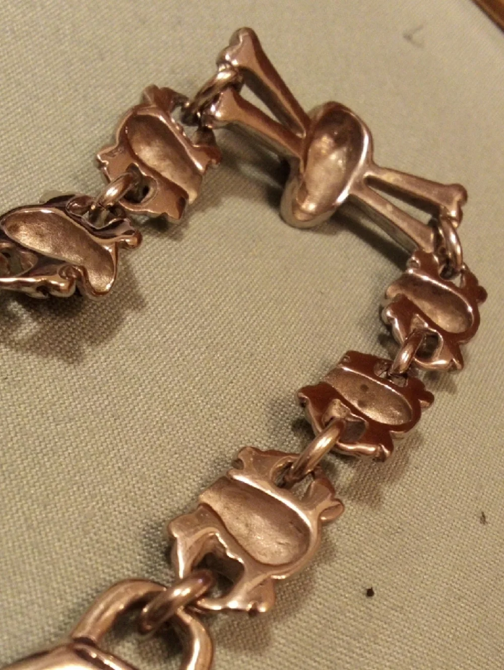 Skull & Crossbones Chunky Bracelet in Metallic Gold Tone